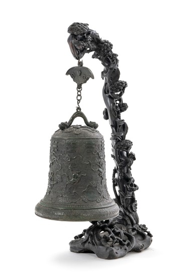 A hanging bronze "temple bell" with a carved wood stand, China, Qing dynasty, 49 cm high (bell), 107 cm high (stand)