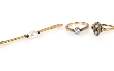 A jewellery set comprising a brooch set with a natural pearl flanked...