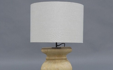 A large contemporary table lamp, circa 2010, carved from a solid block of wood, with cylindrical fabric lined shade, 81cm high It is the buyer's responsibility to ensure that electrical items are professionally rewired for use