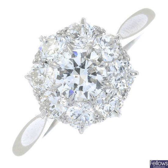 A mid 20th century platinum circular-cut diamond cluster ring.