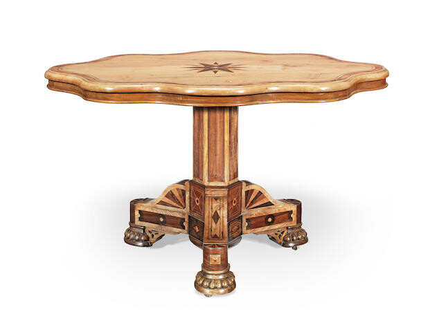 A mid Victorian lace (or plane) wood, tulipwood, ash, ebony and mahogany centre table