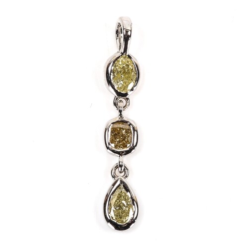 A modern 18ct white gold fancy yellow diamond line pendant, ...