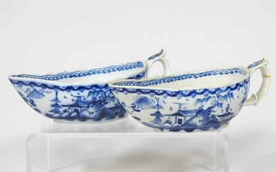A pair of 18th century Staffordshire blue and white sauce...
