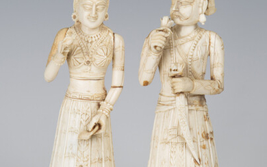 A pair of 19th century Indian carved ivory full-length figures of a lady and gentleman, height 18cm