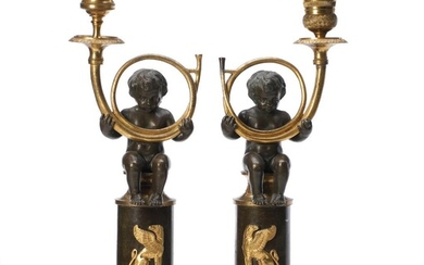 SOLD. A pair of French Empire figral gilt and patinated bronze candlesticks in the shape of putti with horn. C. 1820. H. 30 cm. (2) – Bruun Rasmussen Auctioneers of Fine Art