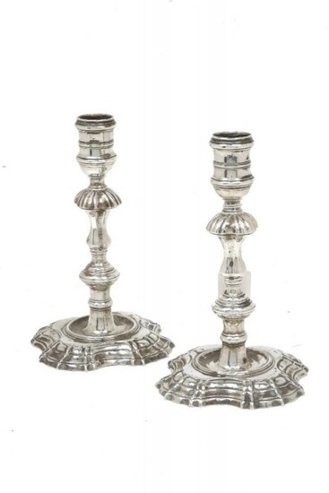 A pair of George II silver candlesticks,...