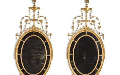 A pair of George III oval giltwood mirrors, late 18th...