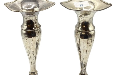 A pair of sterling silver trumpet vases with weighted...