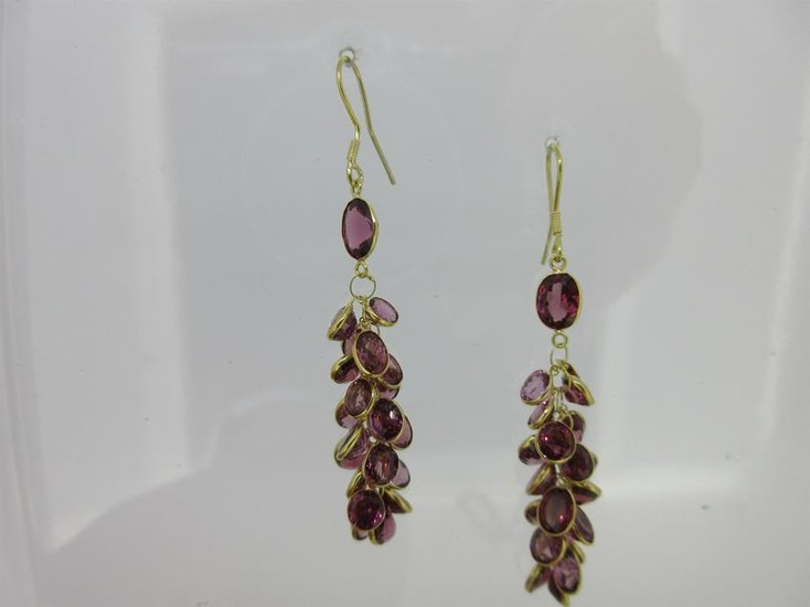A pair of waterfall earpendants set with garnets