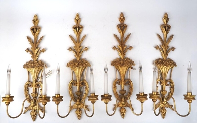 A set of eight giltwood twin-light wall appliques, second half 20th century, the backplates carved with styles vases of flowers with foliate sprays and pine-cone finials, 74cm high (8)