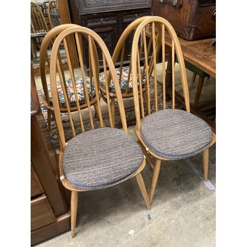 A set of four Ercol light beech comb back Windsor dining cha...
