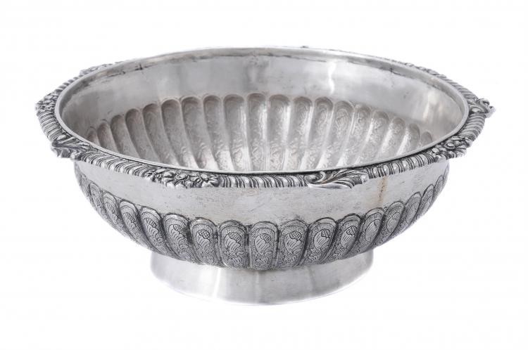 A silver shaped circular bowl