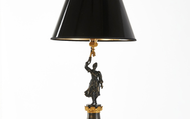 A table lamp, patinated and gilt bronze, France, mid 19th century, late empire, decor in the form of a woman, mounted on a stone plinth.