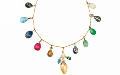 AN EARLY 20TH CENTURY EGG CHARM NECKLACE