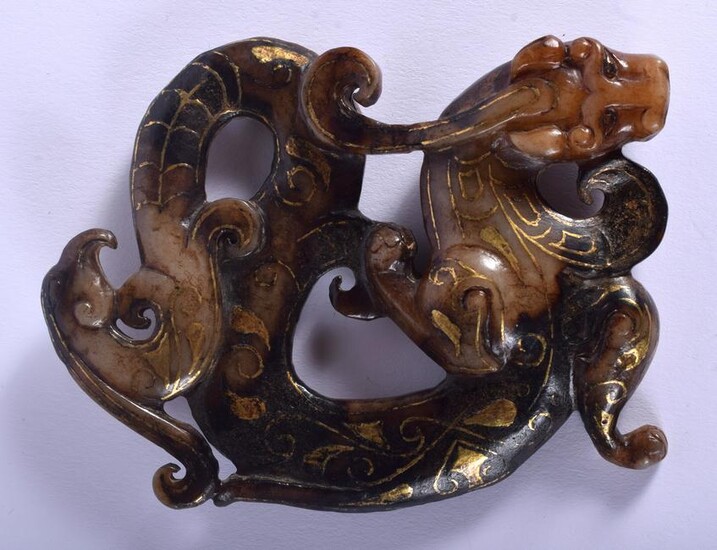 AN EARLY CHINESE GOLD INLAID MUTTON JADE FLATTENED