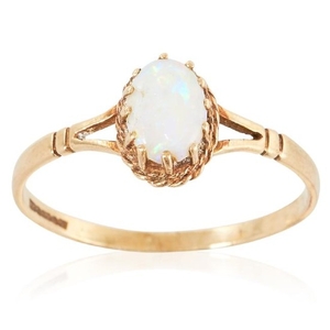 AN OPAL DRESS RING in yellow gold, set with a cabochon