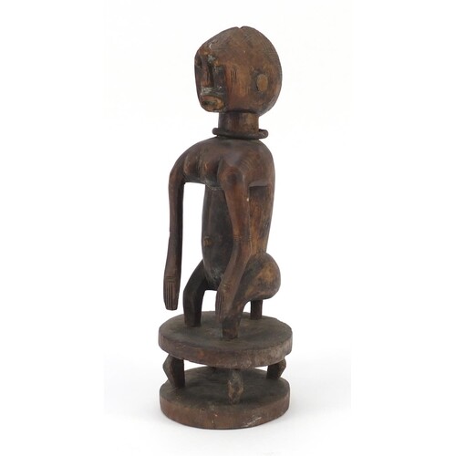 African tribal interest carved wood squatting Chamber figure...