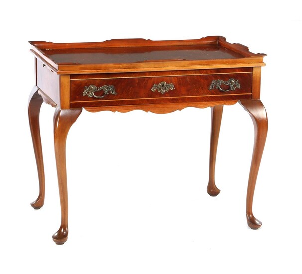 (-), After an antique model tea table with...