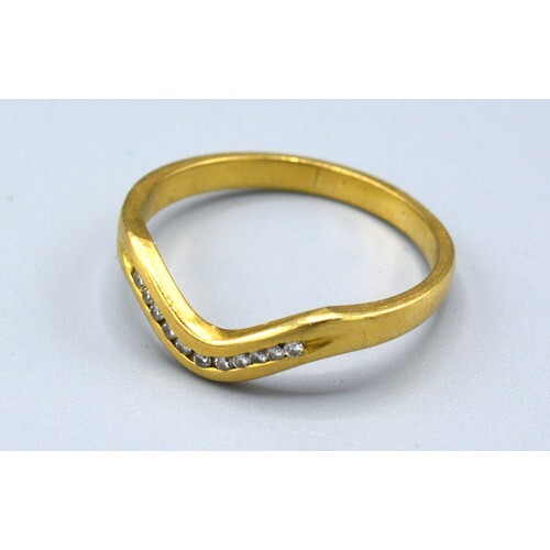 An 18ct Yellow Gold Diamond Set Ring of V Shape set with ele...