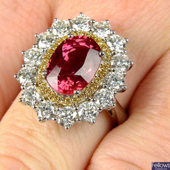 An 18ct gold orange sapphire, 'yellow' diamond and brilliant-cut diamond ring.