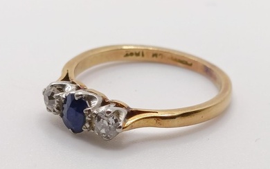 An 18ct gold, sapphire and diamond three stone ring, ring si...