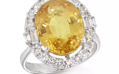 An 18ct white gold yellow sapphire and diamond cluster ring,...