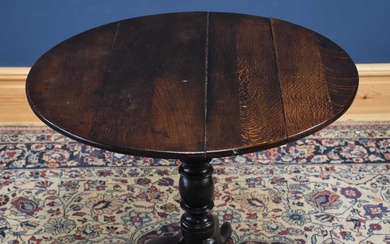 An 18th century oak tilt-top tripod table, height 69cmCondition Report...
