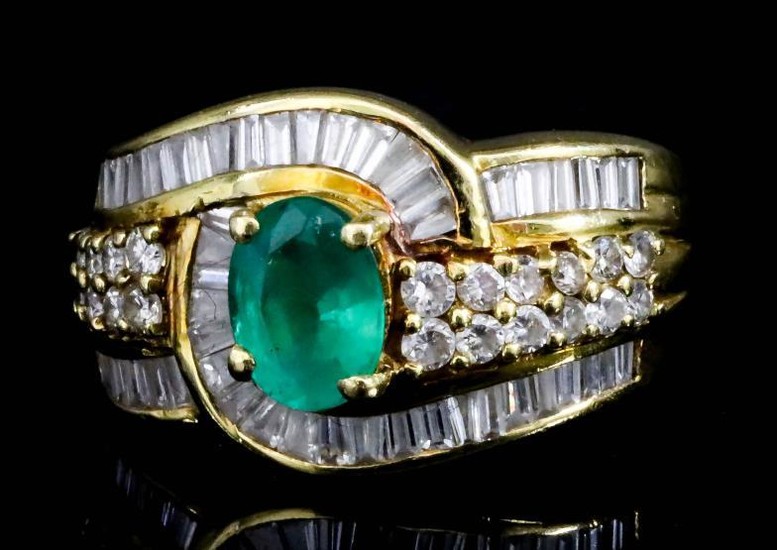 An Emerald and Diamond Ring, Modern, in 18ct gold...