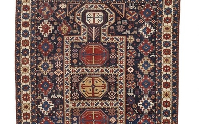 SOLD. An antique Baku rug, Caucasus. A classical key hole design on a blue field surrounded by a number of decorative ornaments. 166 x 140 cm. – Bruun Rasmussen Auctioneers of Fine Art