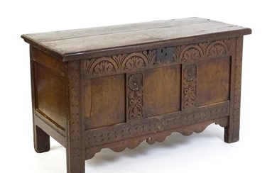 An early 18thC oak coffer of peg jointed construction, with ...