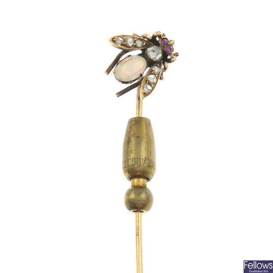 An early 20th century gold opal, diamond and ruby bee stickpin.