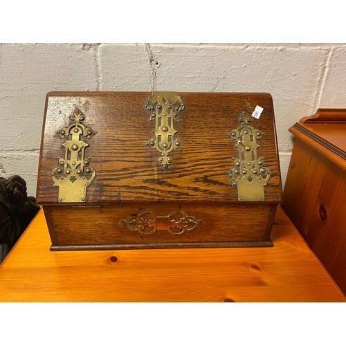 An early 20th century oak stationery box, with Gothic style ...