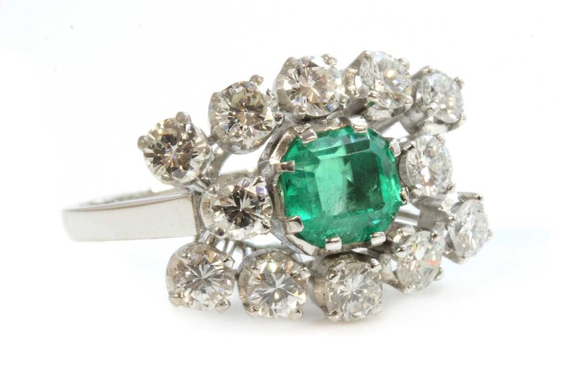 An emerald and diamond three row landscape-shaped cluster ring