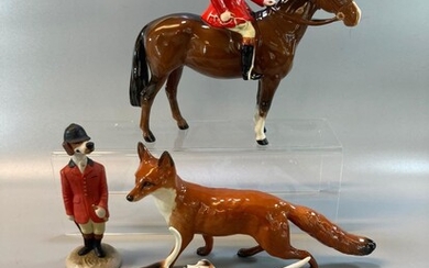 Beswick huntsman on horse with black cap and red...