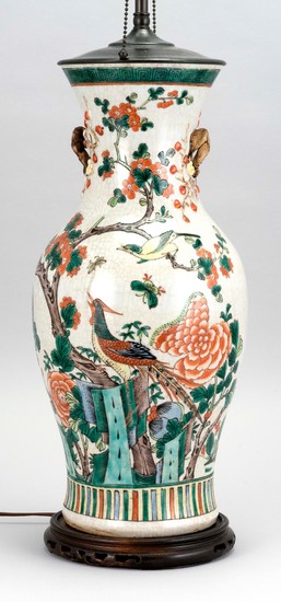 CHINESE FAMILLE VERTE PORCELAIN VASE In baluster form, with tree branch handles and bird and flowering tree decoration. Height 17.25...