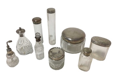 Collection of 19th and 20th century silver topped toiletry bottles