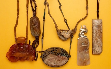 GROUP OF CARVED PENDANTS.