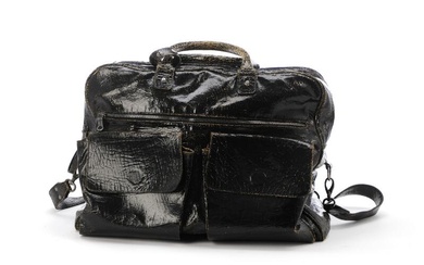 Mac Marmel A travel bag of black distressed leather with silver tone...