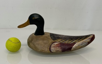North American carved wood decoy duck, 33 cm long. This lot...