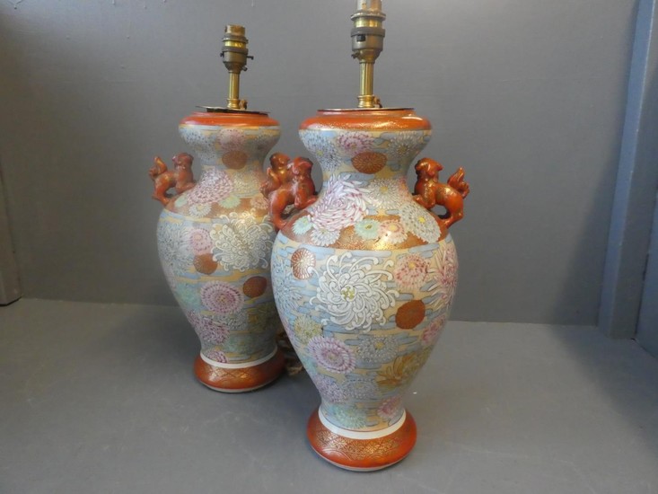 Pair of Japanese vases in the Imari style, with dogs of Fo t...