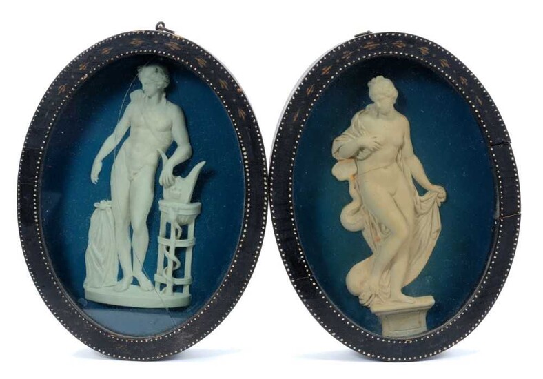 Pair of late 18th/early 19th century composition oval relief plaques depicting classical figures, in oval painted frames