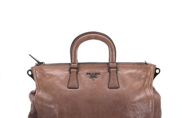 NOT SOLD. Prada: "Bauletto Bag" A bag of brown leather with gold tone hardware. – Bruun Rasmussen Auctioneers of Fine Art