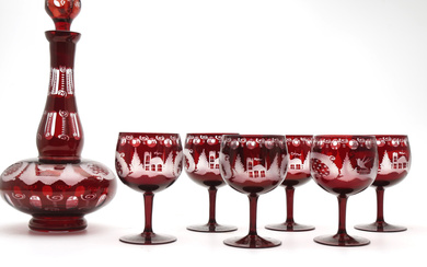 Set of decanter and six goblets in doubled in red, engraved and carved Bohemia glass, first half of the 20th Century.
