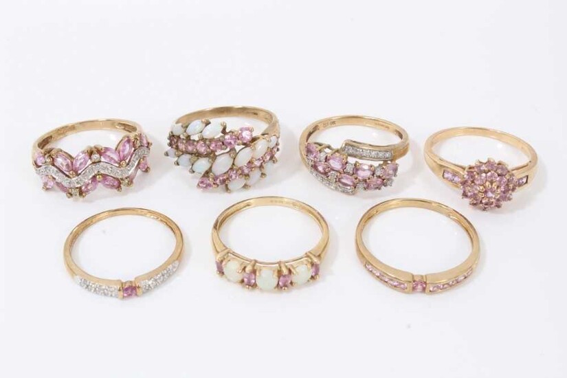 Seven 9ct gold pale pink gem stone dress rings