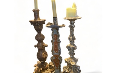 Three Renaissance style candlesticks Two 19th century carved...