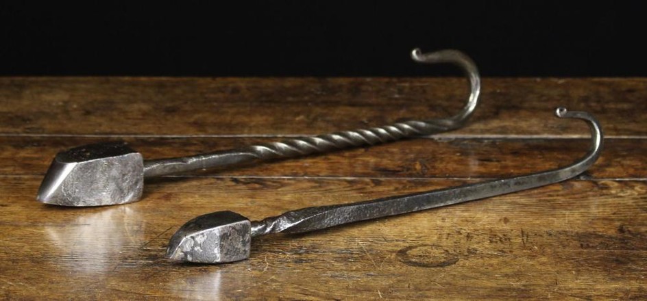 Two Antique Steel Smoothing Irons on wrythen handles with hook ends, 43 cm and 41 cm in length (17''