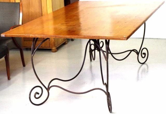 Very large wrought iron table with wooden top. 225cm, by 130...
