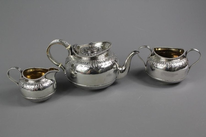 Victorian sterling silver three piece tea set; with raised s...