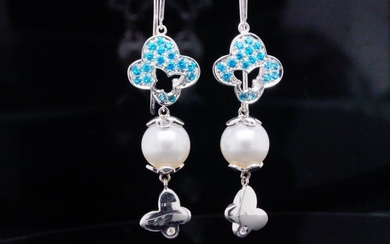 iO Si 0.50ctw Blue Topaz, 10mm Pearl and 18K Earrings