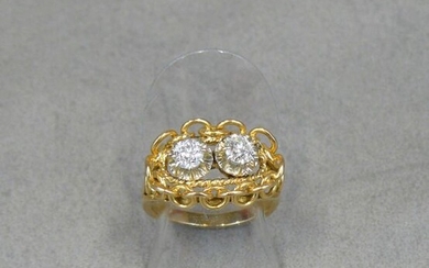 A yellow gold ring (eagle) in the shape of an...